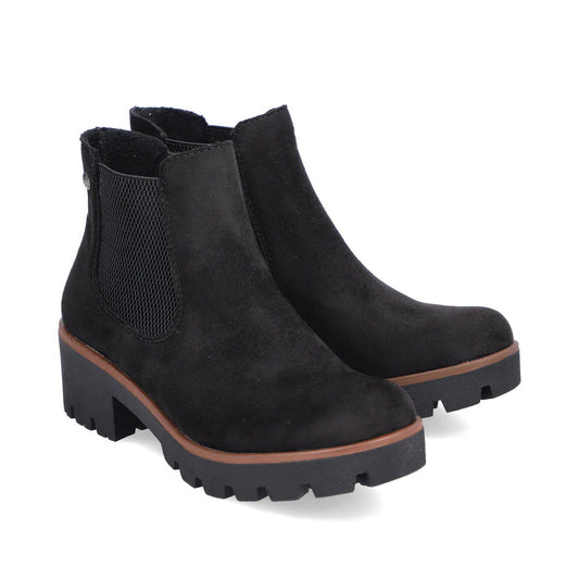 Pair of black suede ankle boots on a white background