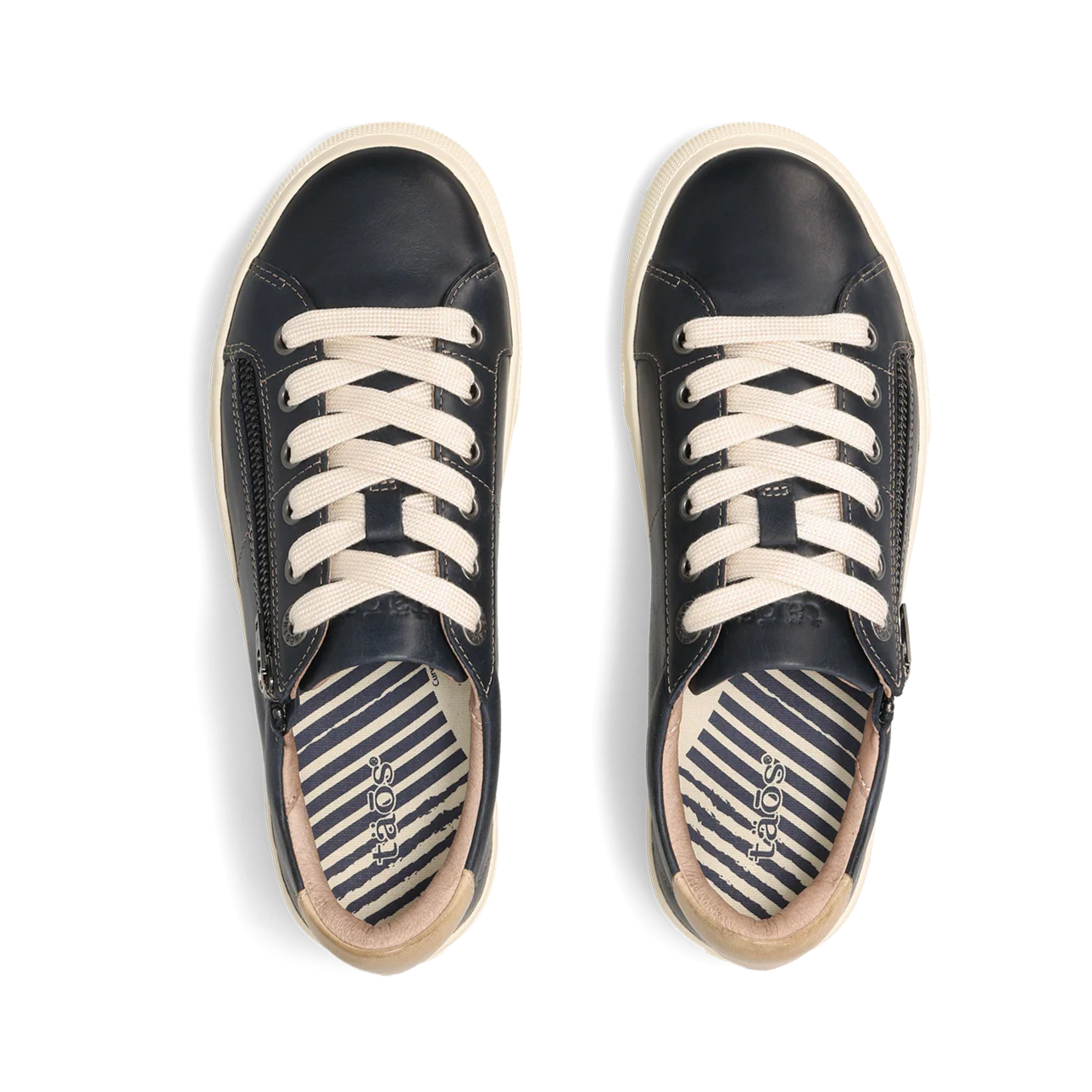 Pair of navy sneakers with white laces on a white background