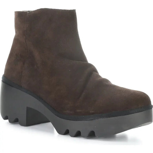 Brown suede ankle boot with a chunky sole on a white background