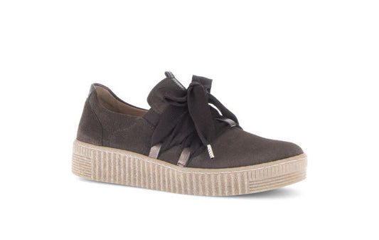 Brown sneaker with a bow on a white background