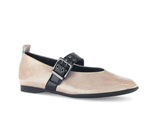 Beige flat shoe with black strap and buckle on a white background