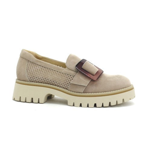 Beige shoe with a buckle on a white background
