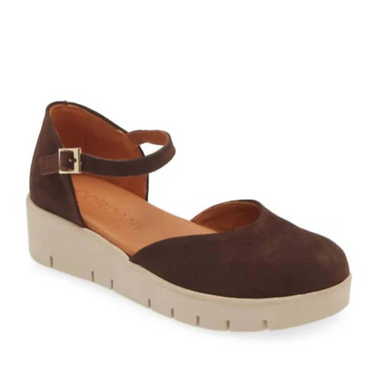 Brown sandal with a strap on a white background