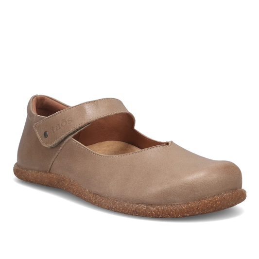 Beige shoe with brown sole on a white background