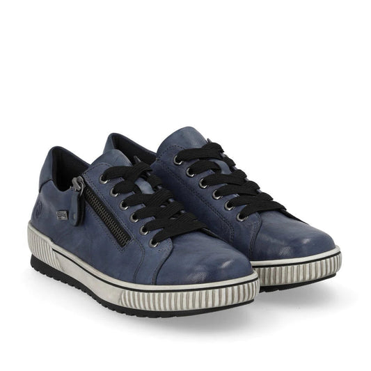 Pair of blue sneakers with black laces on a white background
