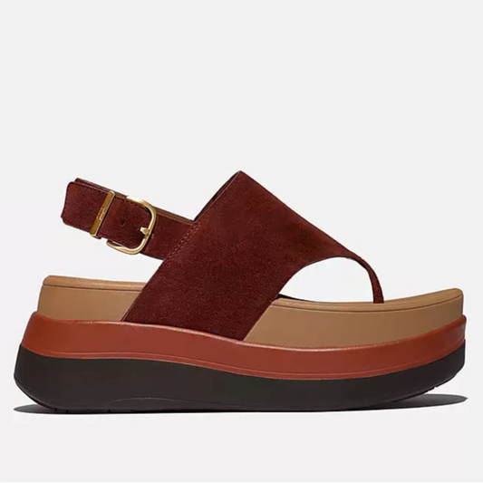 Multicolored sandal with a platform sole on a light gray background
