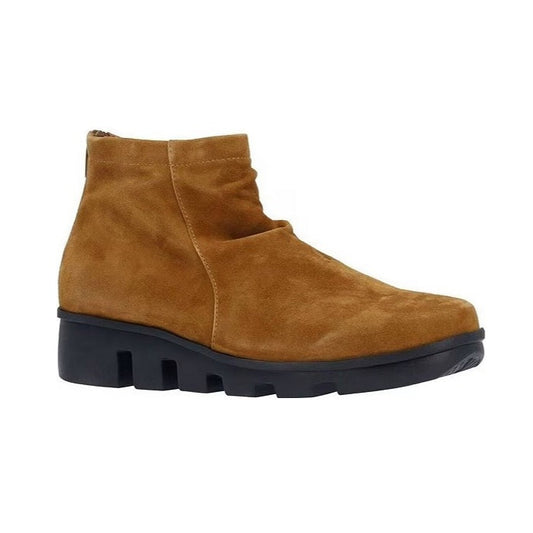 Brown suede ankle boot with black sole on a white background