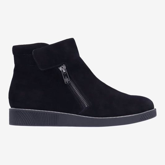 Black ankle boot with a zipper on a white background