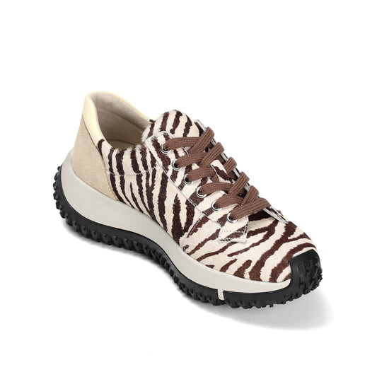 Sneaker with zebra pattern on a white background