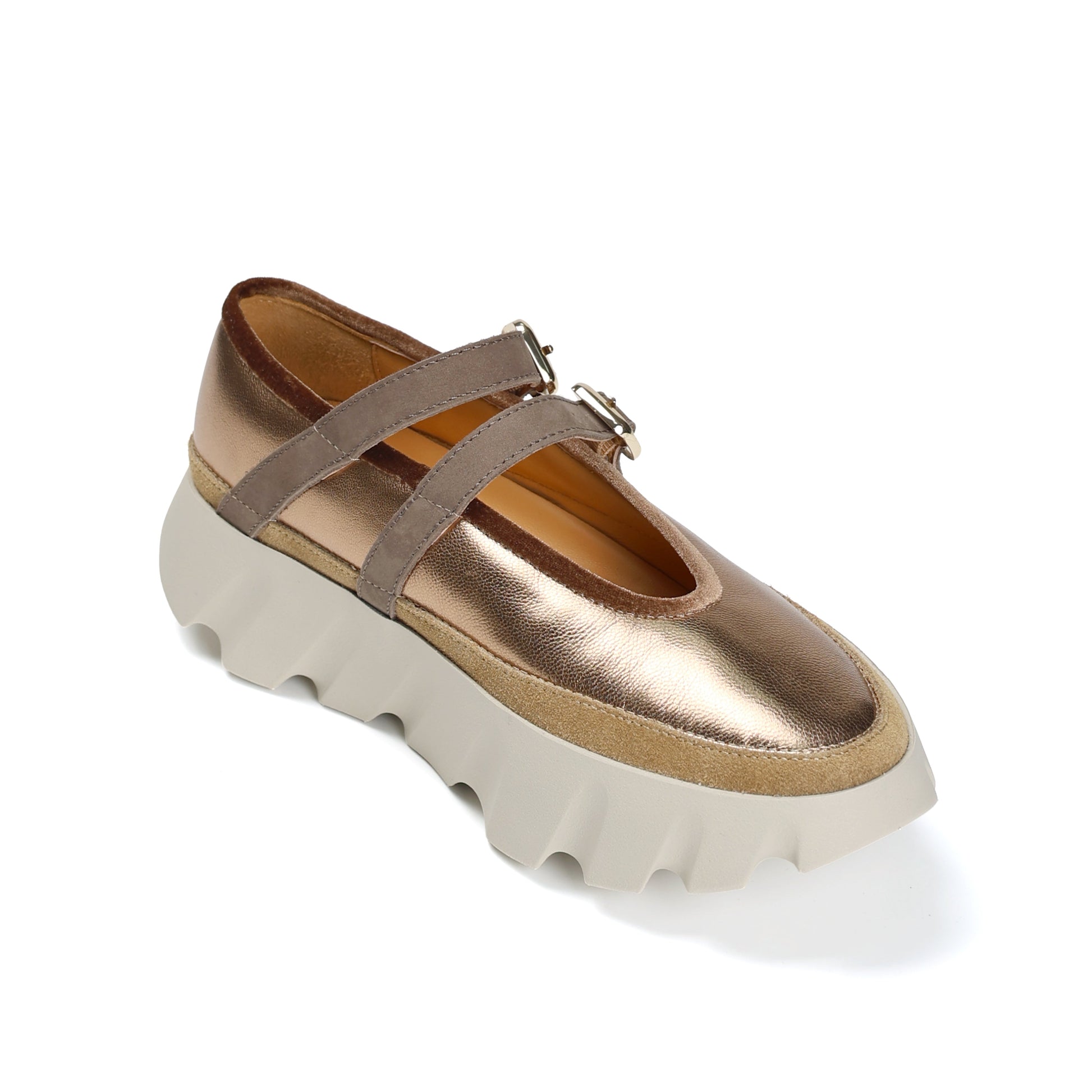 Gold platform shoe with beige sole on a white background