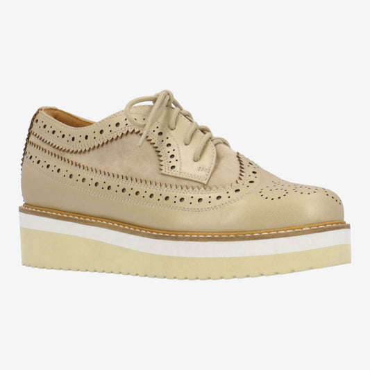 Beige platform shoe with white sole on a white background