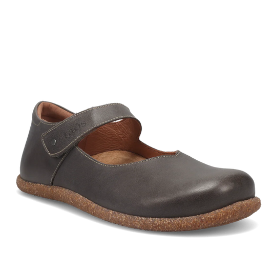 Brown leather shoe with cork sole on a white background