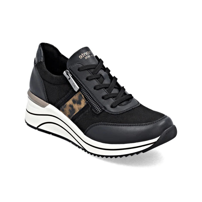 Black sneaker with leopard print detail on a white background