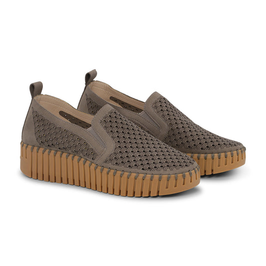 Pair of brown slip-on shoes with textured sole on a white background